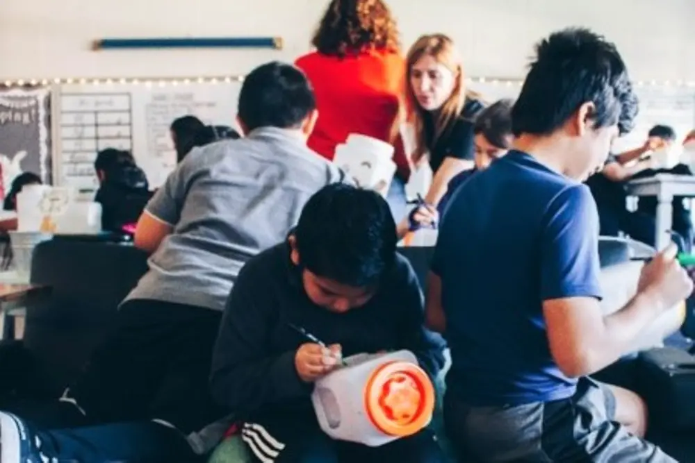 Henkel Sustainability Ambassadors from the Walmart sales office in Bentonville, AR helped fourth graders at Jones Elementary build birdhouses from recyclable materials.