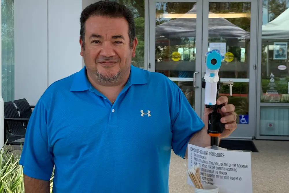 Raffi Krikorian, Facilities Head in Irvine, United States with the hands-free thermometer