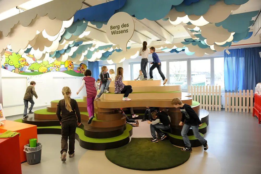 Children playing on the Mountain of Knowledge.