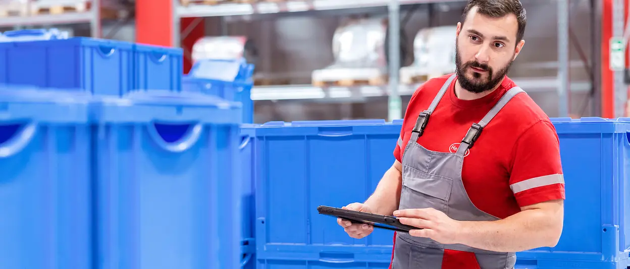 A production worker at Henkel with a tablet computer