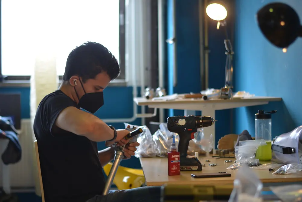 Eduardo Sotelo working on a prosthesis