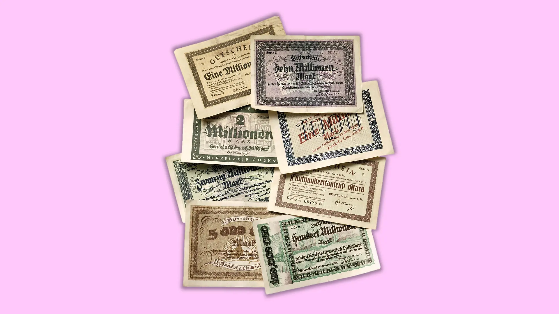 The picture shows various bills of emergency money from 1923, ranging in value from hundreds of thousands of marks to several million marks.