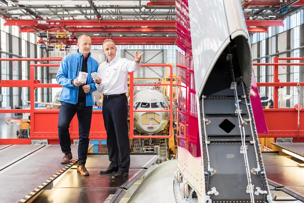 Henkel and Airbus employees in Airbus assemby hall.